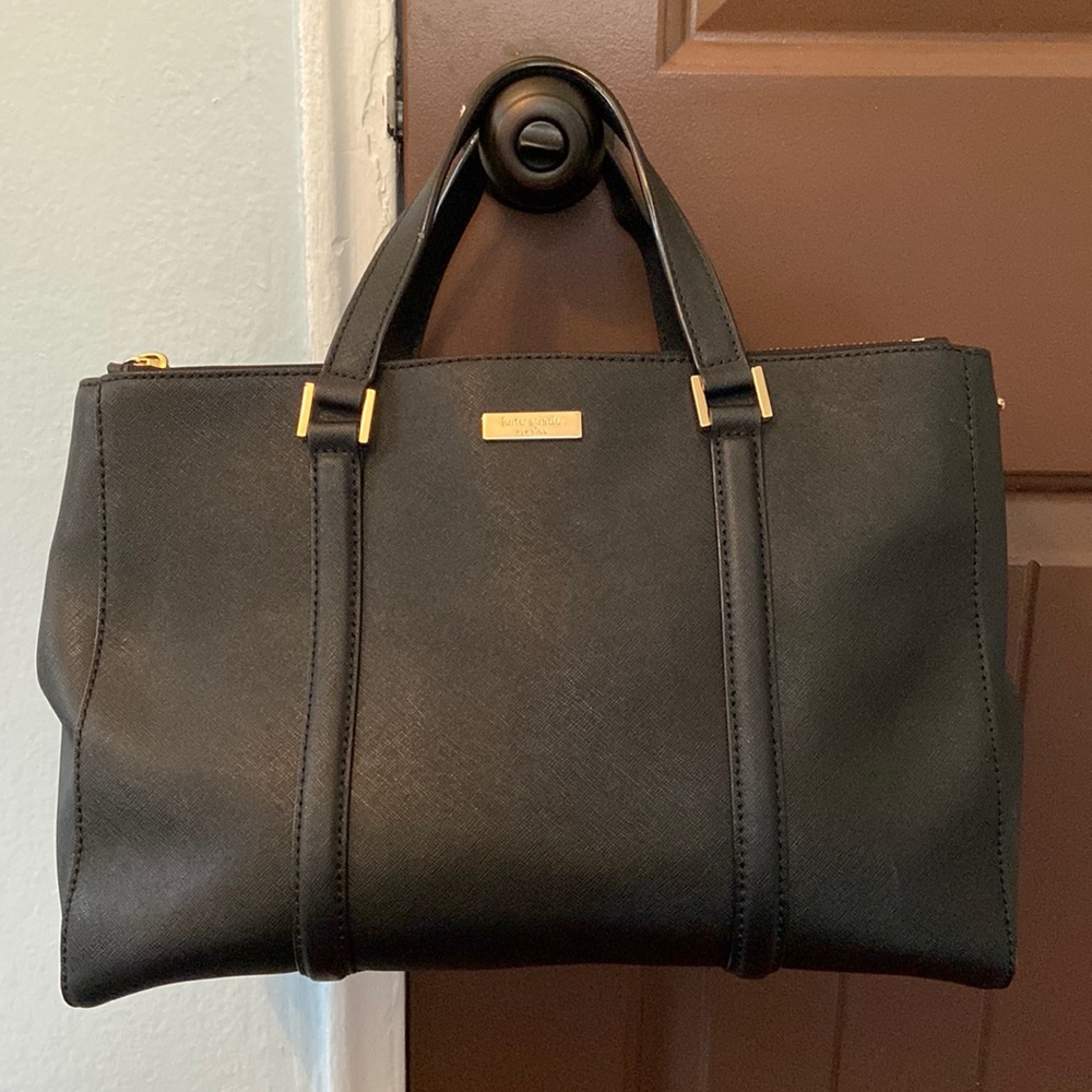 kate spade bag with shoulder strap. there are some scratches on the handles